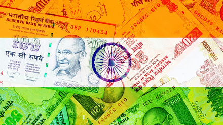Flag of India mixed with Indian rupees background.jpg